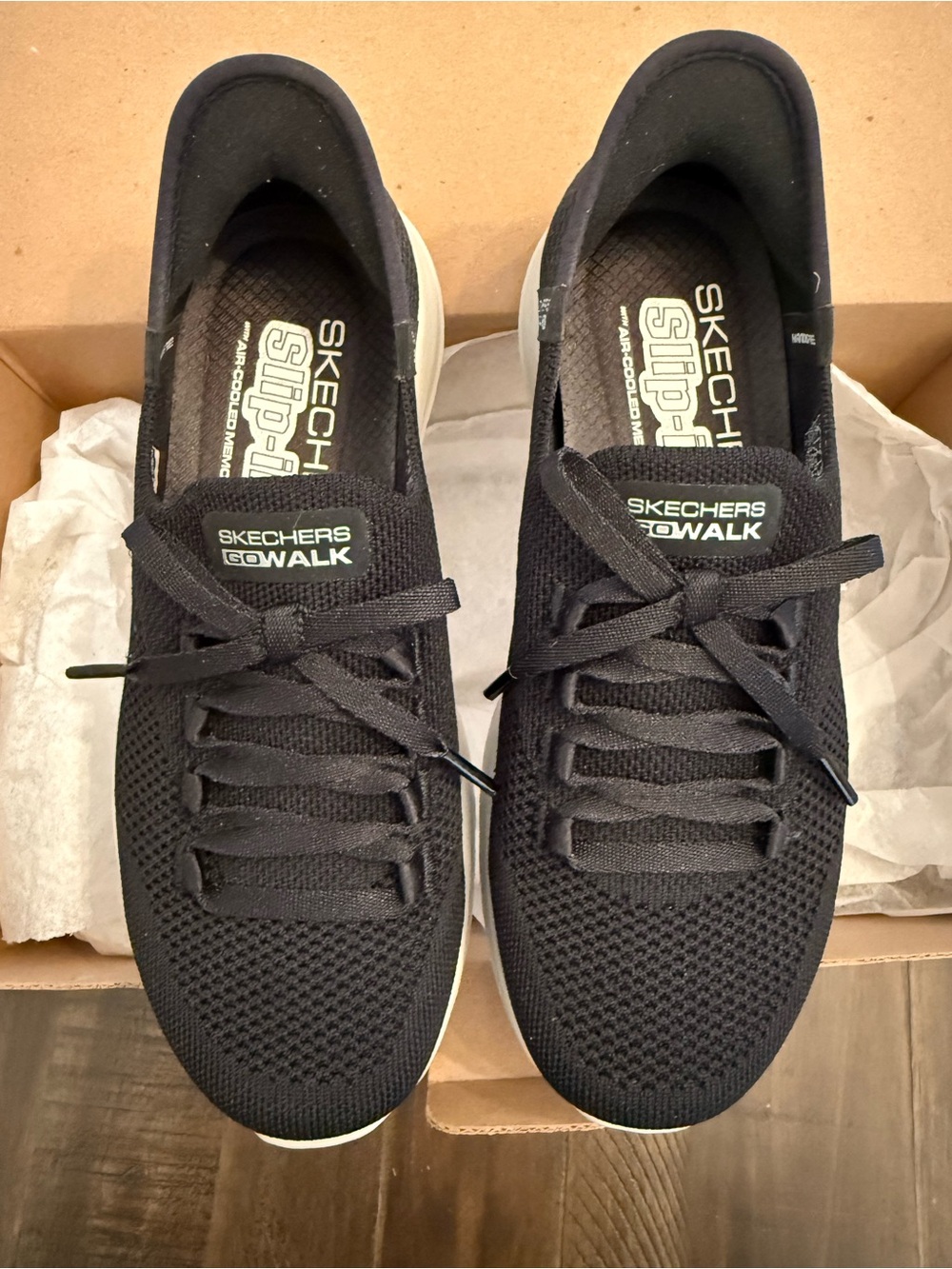 Skechers GOwalk slip in Women's Black Knit Slip-On Sneakers with White Sole